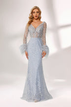 Set against a light backdrop, a woman dons a light - blue sequin gown with sheer sleeves and feather cuffs. It has a V - neckline, a mermaid - shaped skirt, and shimmering sequins. The unique feather details and sparkling fabric create a glamorous look, ideal for proms or formal evening events.1