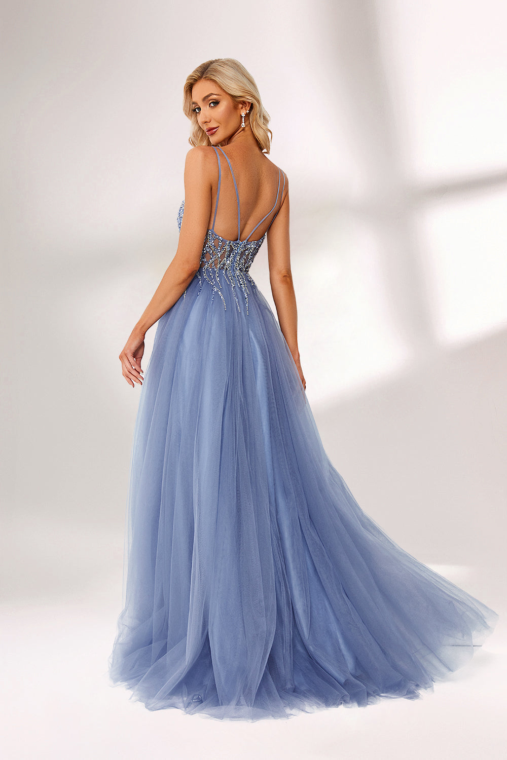 Light blue tulle prom dress with beaded bodice, double straps, slit detail & ball gown skirt. Elegant and eye-catching—ideal for bulk premium formalwear stock.03