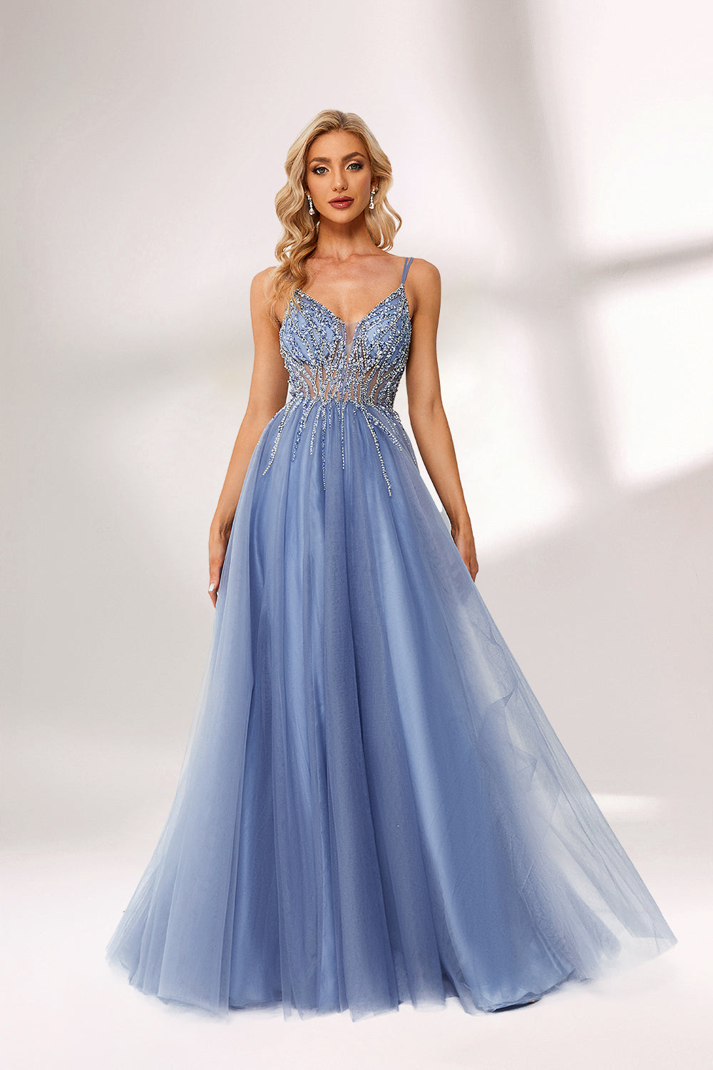 Light blue tulle prom dress with beaded bodice, double straps, slit detail & ball gown skirt. Elegant and eye-catching—ideal for bulk premium formalwear stock.05