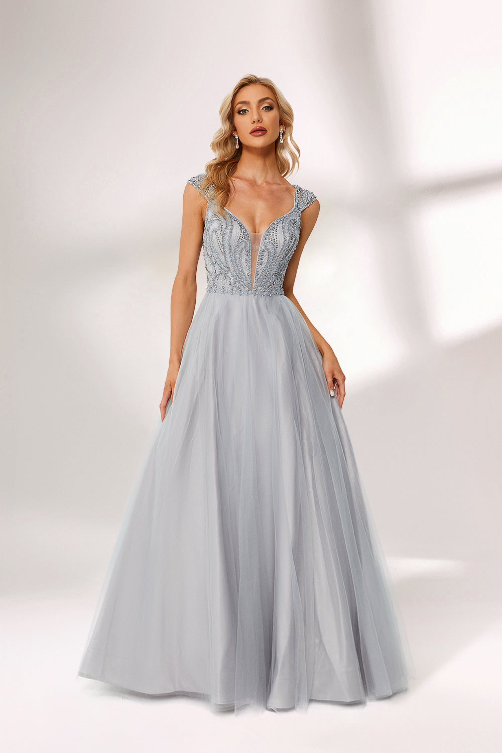 Silver gray tulle prom dress with beaded bodice, illusion back & cap sleeves. V-neck ball gown design adds elegance. Great for formal events & bulk buys.01