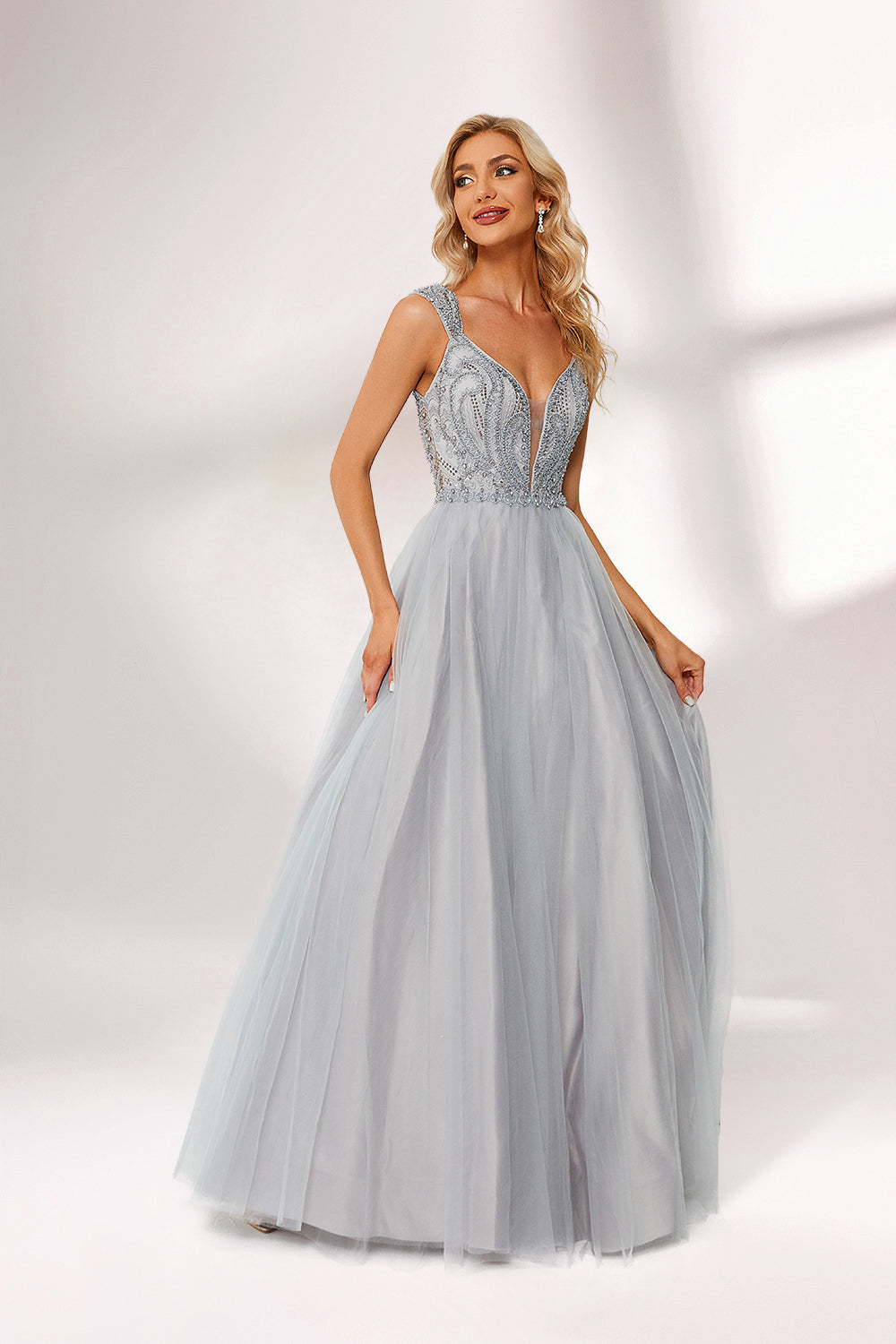 Silver gray tulle prom dress with beaded bodice, illusion back & cap sleeves. V-neck ball gown design adds elegance. Great for formal events & bulk buys.04