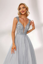 Silver gray tulle prom dress with beaded bodice, illusion back & cap sleeves. V-neck ball gown design adds elegance. Great for formal events & bulk buys.05