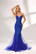 Bathed in soft light, a woman dazzles in a royal - blue sequined mermaid gown. It features thin straps, a deep V - neckline, and a flowing tulle skirt. The shimmering sequins lend an air of opulence, perfect for grand galas or red - carpet moments.1