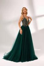 Dark green tulle prom dress with gold lace bodice, criss-cross back, plunge neckline, and A-line skirt. Elegant and chic, ideal for bulk orders and formal events.06