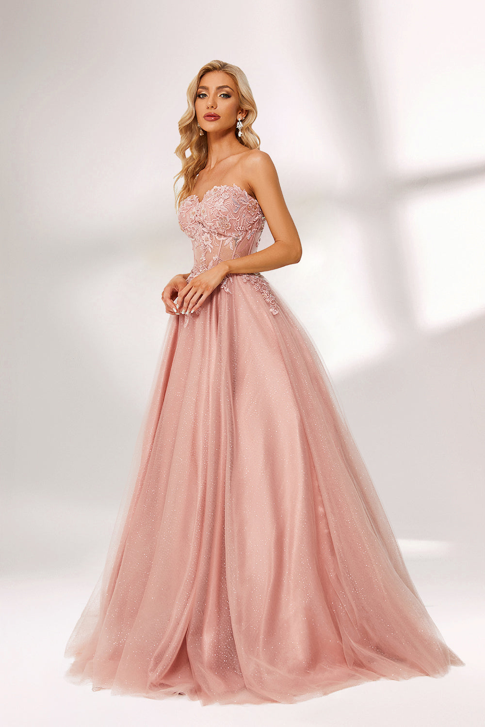 Blush pink tulle prom dress with strapless lace bodice, corset back, floral embroidery, and ball gown silhouette—ideal for bulk elegant formal collections.03