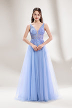 Bathed in soft light, a woman dazzles in a light blue tulle gown. It has a deep V - neckline with delicate lace embroidery on the bodice, and a flowing tulle skirt. The ethereal design creates a romantic and dreamy look, perfect for formal events like proms or weddings.3