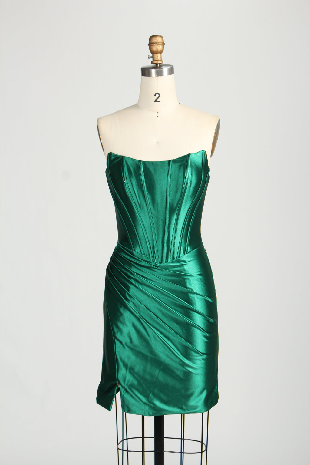 Exude elegance in this dark - green strapless satin homecoming dress with ruched details.01