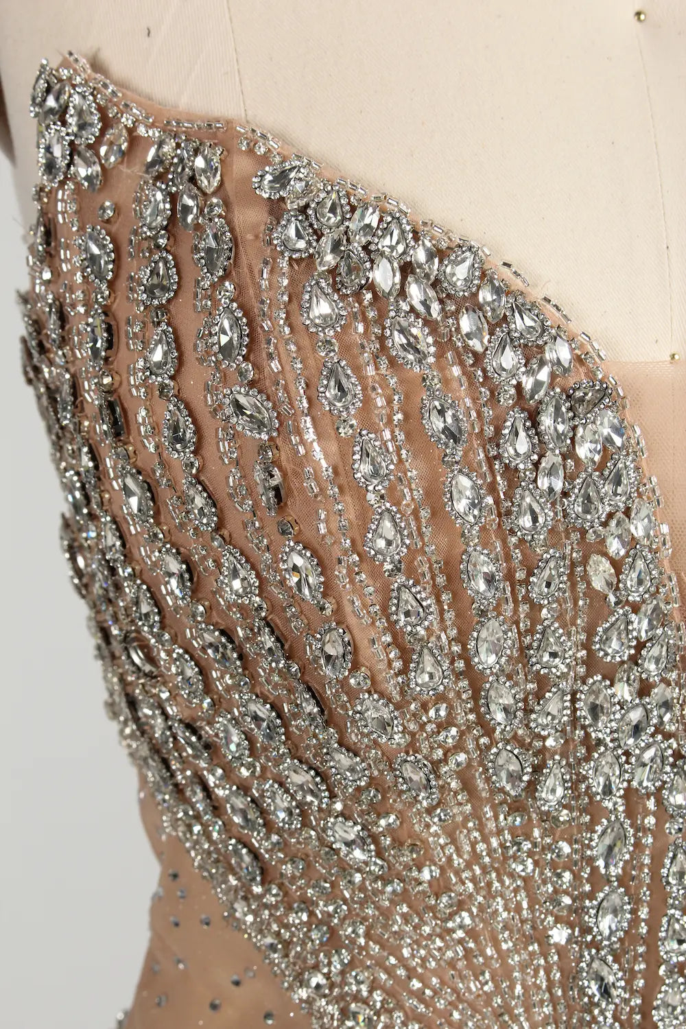 Close-up of silver beaded embellishment on V-neck halter bodice