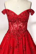 Photograph of an elegant, off-the-shoulder red ball gown on a white dress form. The dress features intricate, sparkling beadwork on the bodice and a voluminous, flowing skirt adorned with delicate floral patterns. The background is a plain white studio setup with soft shadows, emphasizing the dress's vibrant color and luxurious texture.03