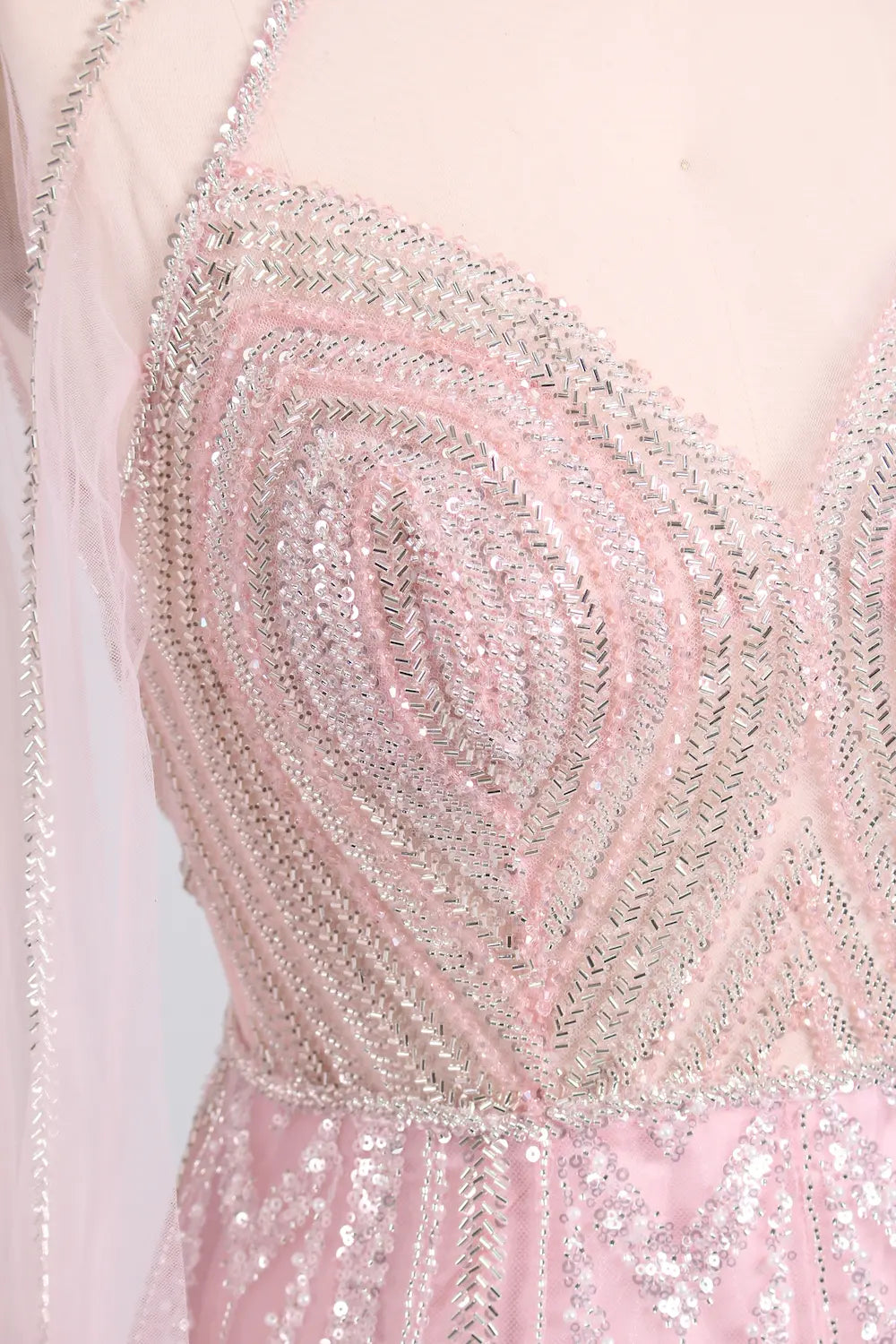 Crystal beaded heart-motif bodice on blush pink tulle A-line cape gown