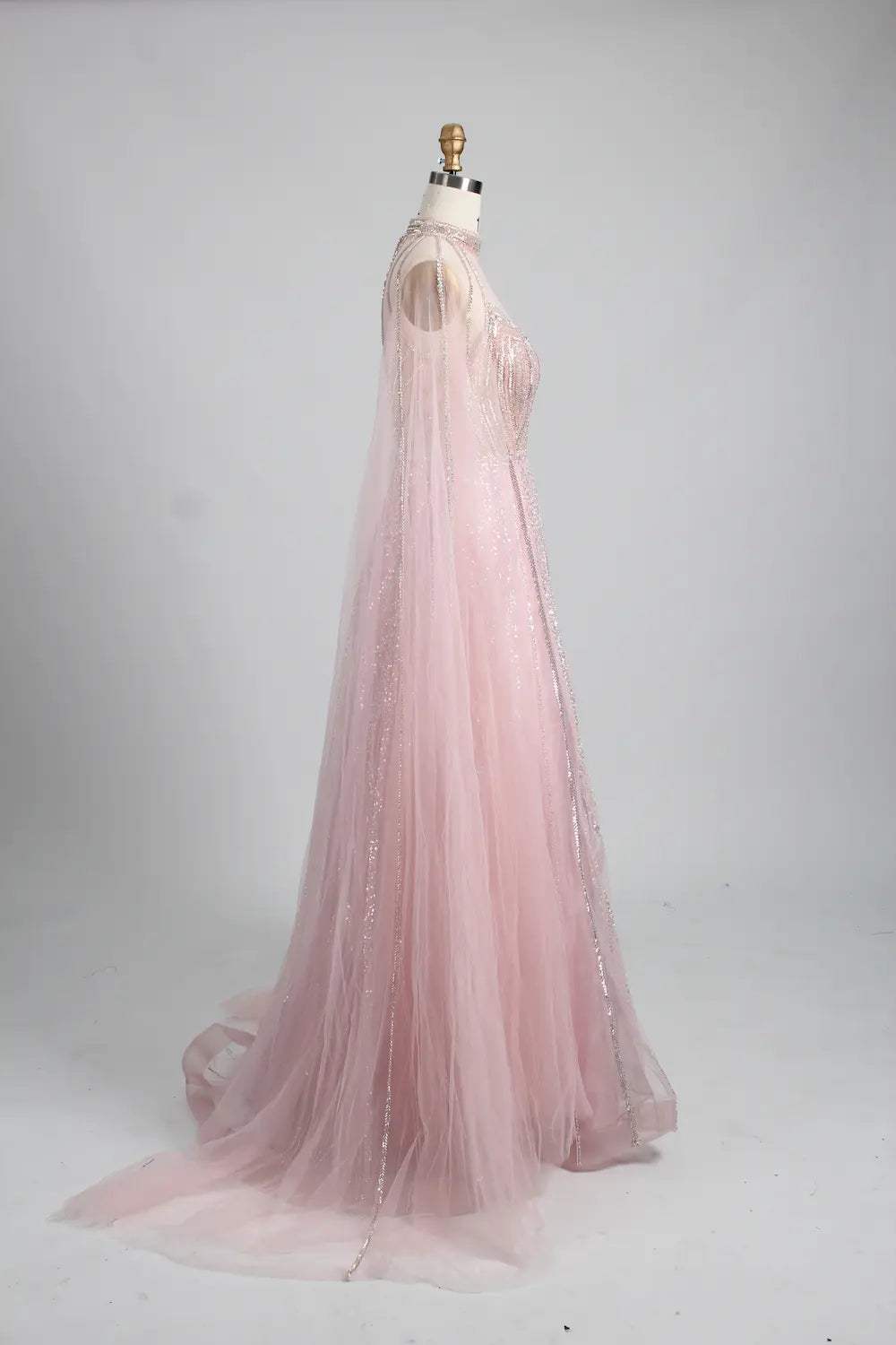 Blush pink A-line cape gown with long sheer cape and glittering bead trim