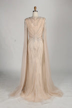 Champagne beaded tulle mermaid gown with sheer cape sleeves and sweetheart neckline