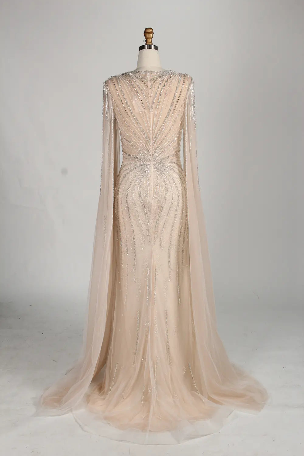Champagne beaded tulle mermaid gown with sheer cape sleeves and sweetheart neckline