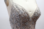 Displayed on a mannequin is a silver - gray mermaid - style gown. It features thin straps, a sweetheart neckline, intricate bead and sequin embroidery throughout, and a flowing tulle skirt. The elegant design creates a glamorous look, perfect for formal events like proms or weddings.6
