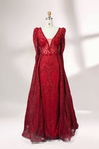Illuminated softly, a mannequin showcases a light - gray evening gown. With a deep V - neckline, long puffed sleeves, and elaborate bead and lace embroidery, the gown exudes an air of luxury and sophistication, making it an excellent choice for formal galas and upscale events.5