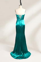 
A mannequin showcases a teal satin strapless gown. It has a ruched bodice, a fitted silhouette, and a flowing, floor - length skirt with a subtle train. The elegant design, featuring gathered details, makes it suitable for formal events like galas or weddings.2