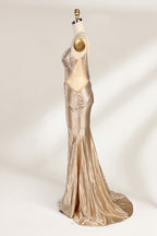Set against a light backdrop, a mannequin presents a champagne - colored, beaded mermaid gown. It features a sweetheart neckline, cut - out sides, and intricate bead patterns radiating from the bodice. The shimmering beads and figure - hugging silhouette create a glamorous look, ideal for evening galas or proms.4