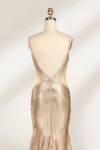 Set against a light backdrop, a mannequin presents a champagne - colored, beaded mermaid gown. It features a sweetheart neckline, cut - out sides, and intricate bead patterns radiating from the bodice. The shimmering beads and figure - hugging silhouette create a glamorous look, ideal for evening galas or proms.5
