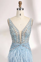 In soft lighting, a woman dazzles in a blue evening gown. With feather details, sequin embellishments, and a mermaid silhouette, it creates a luxurious and eye - catching look for formal events.5