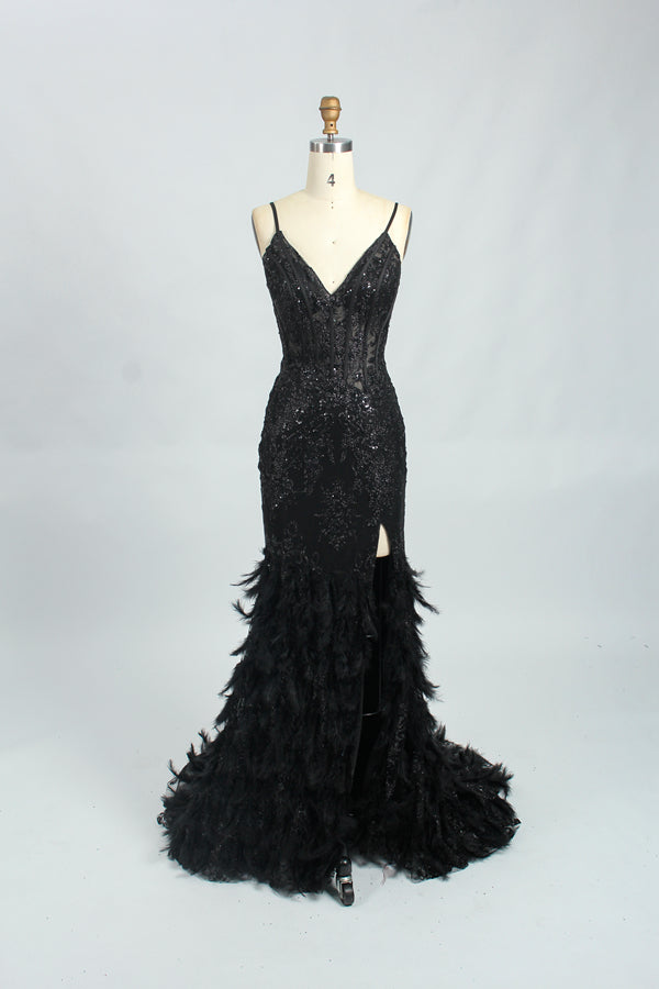 Illuminated softly, a woman captivates in a pink - purple evening gown. With sequin and feather details, a mermaid silhouette, and a high slit, it creates a glamorous and alluring look for formal events.7