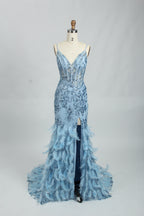 Illuminated softly, a woman captivates in a pink - purple evening gown. With sequin and feather details, a mermaid silhouette, and a high slit, it creates a glamorous and alluring look for formal events.8