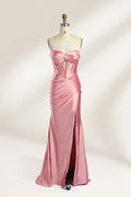 Against a gentle, light - colored backdrop, a mannequin showcases a strapless pink satin gown. The bust flaunts a twisted design, with a sheer insert at the bodice, and the waist is adorned with ruching. The mermaid - style skirt, featuring a high side slit, radiates elegance, perfect for formal galas.1