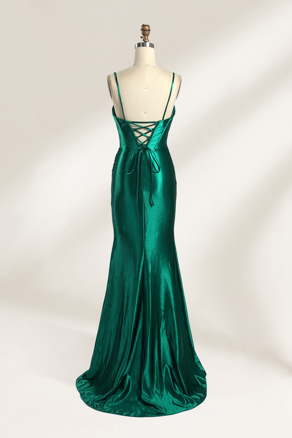 Against a gentle, light - colored backdrop, a mannequin showcases a strapless pink satin gown. The bust flaunts a twisted design, with a sheer insert at the bodice, and the waist is adorned with ruching. The mermaid - style skirt, featuring a high side slit, radiates elegance, perfect for formal galas.2