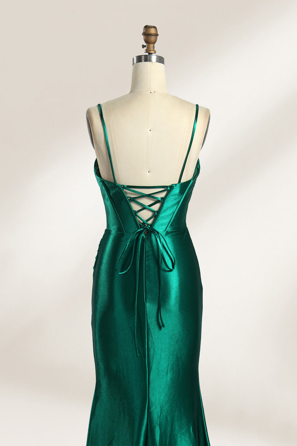 Against a gentle, light - colored backdrop, a mannequin showcases a strapless pink satin gown. The bust flaunts a twisted design, with a sheer insert at the bodice, and the waist is adorned with ruching. The mermaid - style skirt, featuring a high side slit, radiates elegance, perfect for formal galas.6