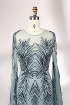 Showcased on a mannequin is a light - teal evening gown. It features a sheer high - neck design, long flowing sleeves, and intricate leaf - pattern embroidery. The gown's elegant and unique design exudes a sense of sophistication and grace, making it an ideal choice for formal events.
3