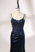 This is a floor - length evening dress in a deep navy hue. It has a strapless style with thin shoulder straps. The bodice is embellished with delicate beadwork and embroidery, creating an elegant and glamorous look. The skirt is form - fitting around the hips and flows down to the floor, featuring a side slit that adds allure and allows for easy movement. Displayed on a mannequin against a simple, light - colored backdrop, the dress exudes sophistication, perfect for special occasions like galas or proms.03