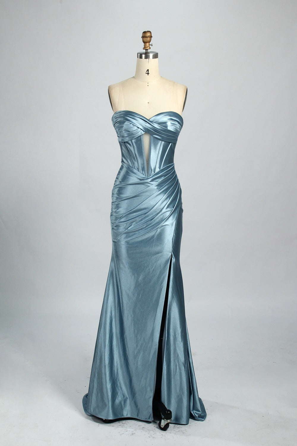 Against a gentle, light - colored backdrop, a mannequin showcases a strapless pink satin gown. The bust flaunts a twisted design, with a sheer insert at the bodice, and the waist is adorned with ruching. The mermaid - style skirt, featuring a high side slit, radiates elegance, perfect for formal galas.7