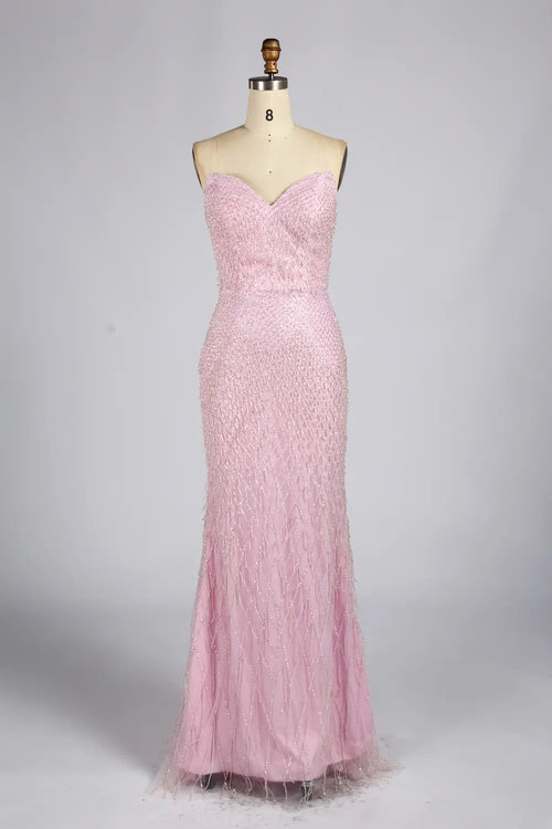 Blush pink strapless sequin mermaid evening dress with fitted bodice and long train