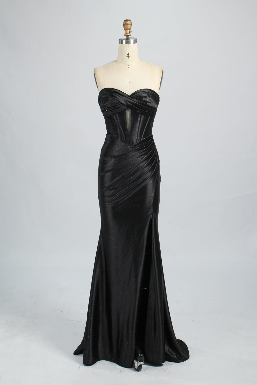 This is a strapless royal - blue gown. It features a twisted - front design at the bustline, with a sheer panel in the middle of the bodice. The waist is cinched with ruched detailing, and the skirt is mermaid - shaped with a high side slit. Paired with silver - glittered heels, it exudes elegance and sensuality, perfect for formal events like galas or balls.8
