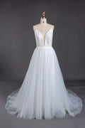 Plunging V - neck, spaghetti straps, lace bodice & tulle wedding dress.