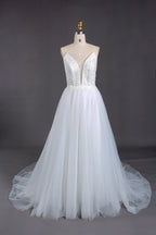 Plunging V - neck, spaghetti straps, lace bodice & tulle wedding dress.
