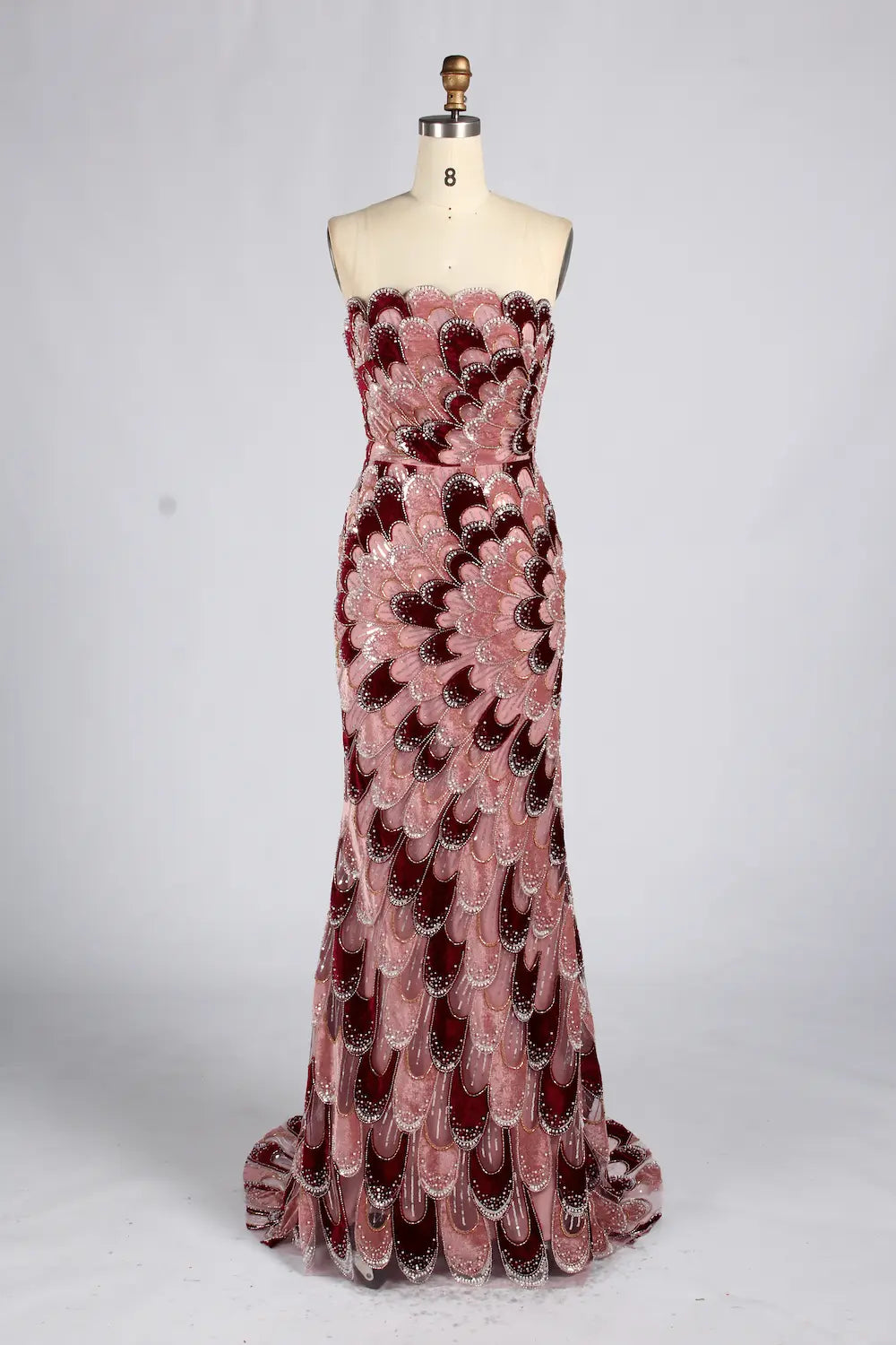 Strapless mermaid evening dress with pink and dark sequin feather pattern, fitted bodice