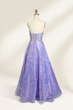 This is a purple evening gown. It has a strapless, sweetheart neckline. The bodice features intricate patterns, cinched at the waist with a thin belt. The floor - length skirt, made of tulle, is covered in iridescent embroidery. Perfect for formal events, it exudes elegance and a dreamy vibe.0