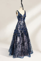 This is an evening gown displayed on a mannequin. It features a deep V - neckline and a sleeveless design. The dress is adorned with numerous blue three - dimensional floral embroideries and black patterns across the bodice and the floor - length skirt. The wide, trailing skirt creates an elegant and formal appearance, making it perfect for occasions such as dinners and balls.04
