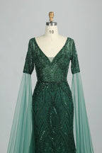 Embellished V-neck mermaid dress with short cape sleeves and dark green sequin pattern