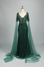 Embellished mermaid dress with V-neck, dark green sequins, and flowing tulle sleeves