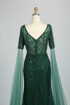 Embellished V-neck mermaid dress with dark green sequins and cape sleeves
