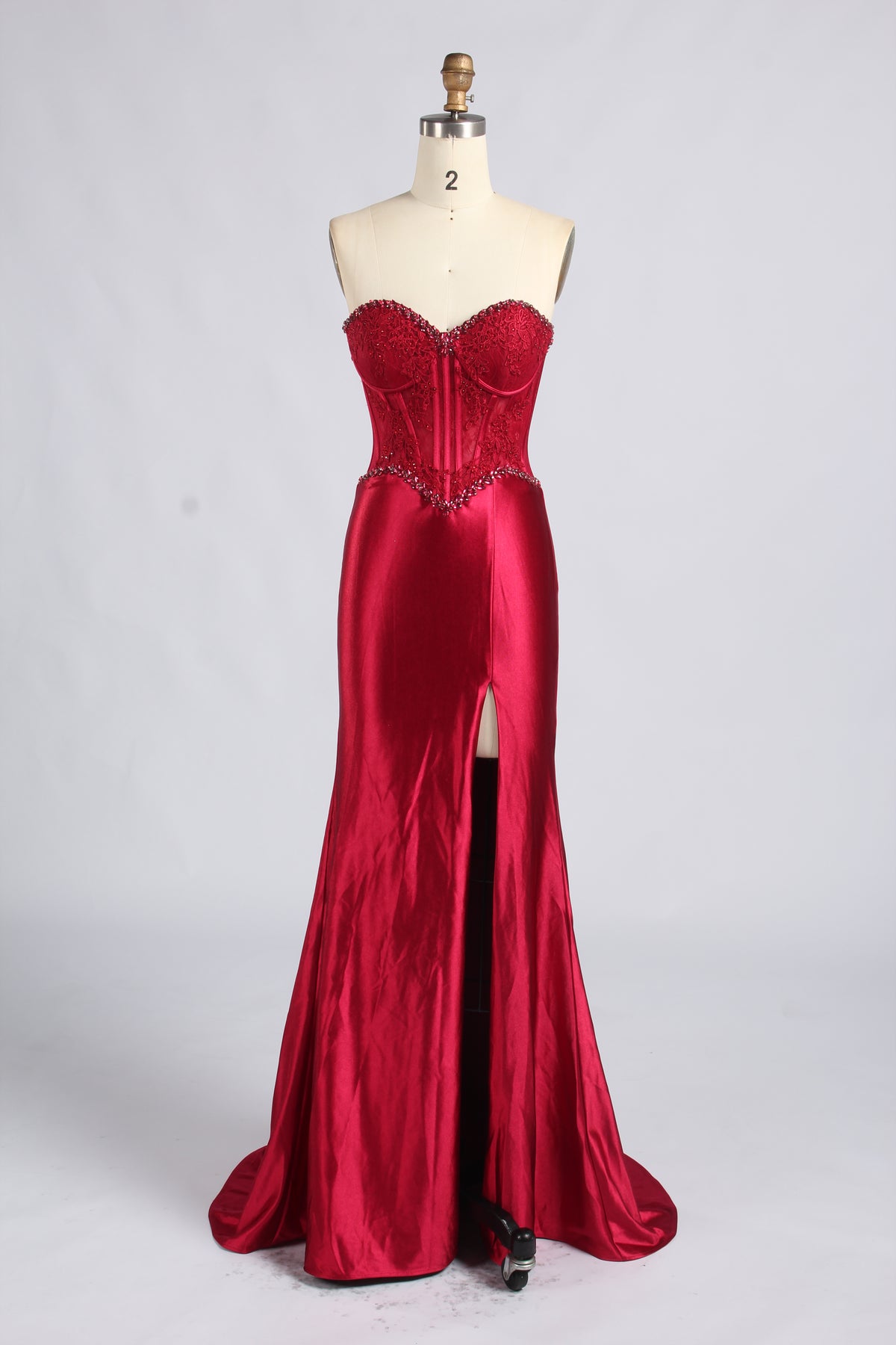 Red strapless satin mermaid prom dress with beaded corset bodice