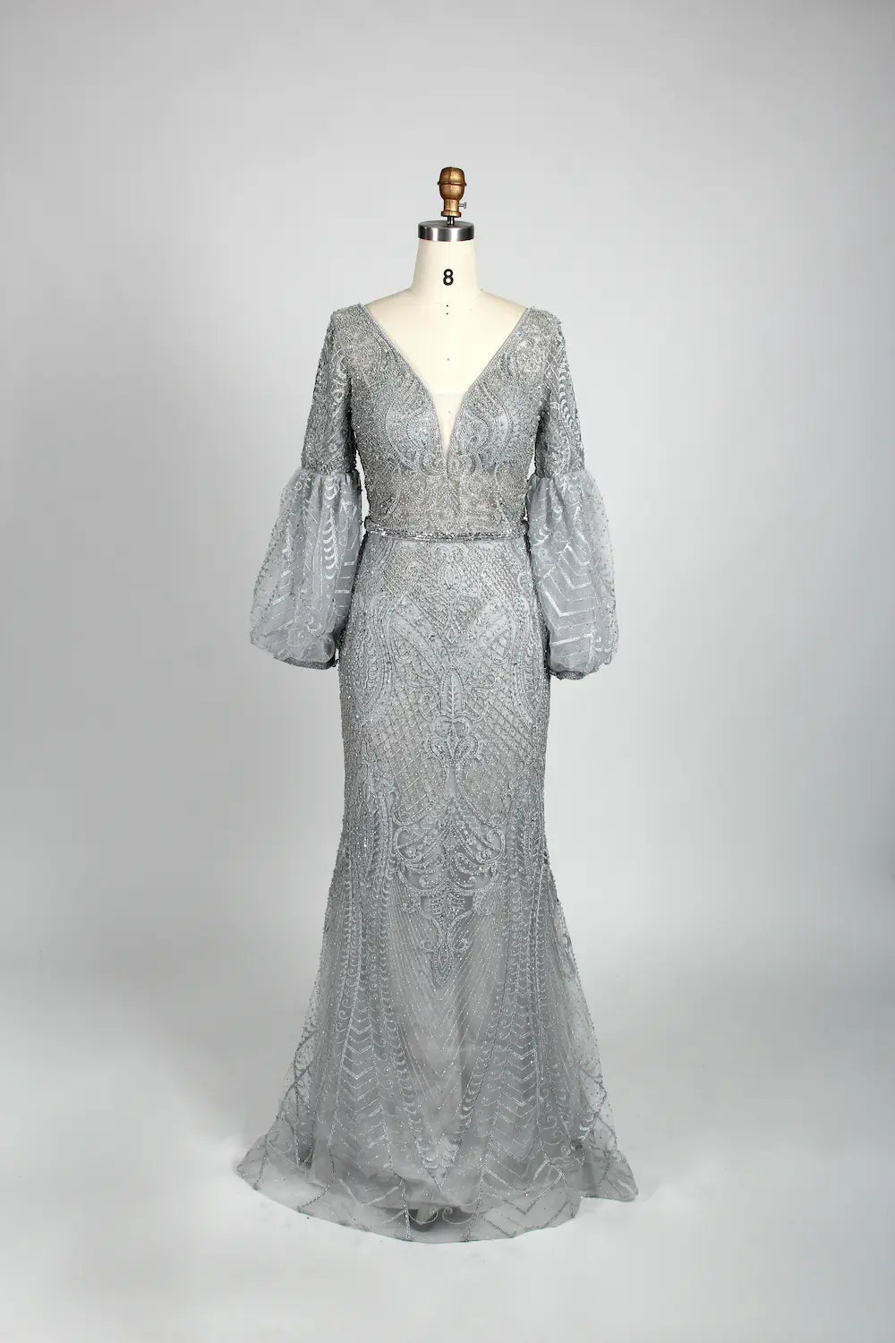 Beaded A-line cape gown in silver-gray with V-neck and long drapey sleeves