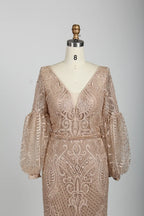 Beaded V-neck A-line cape gown in nude blush with ornate geometric lace sleeves