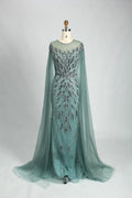 Teal beaded tulle cape mermaid evening dress with long sleeves and fitted skirt