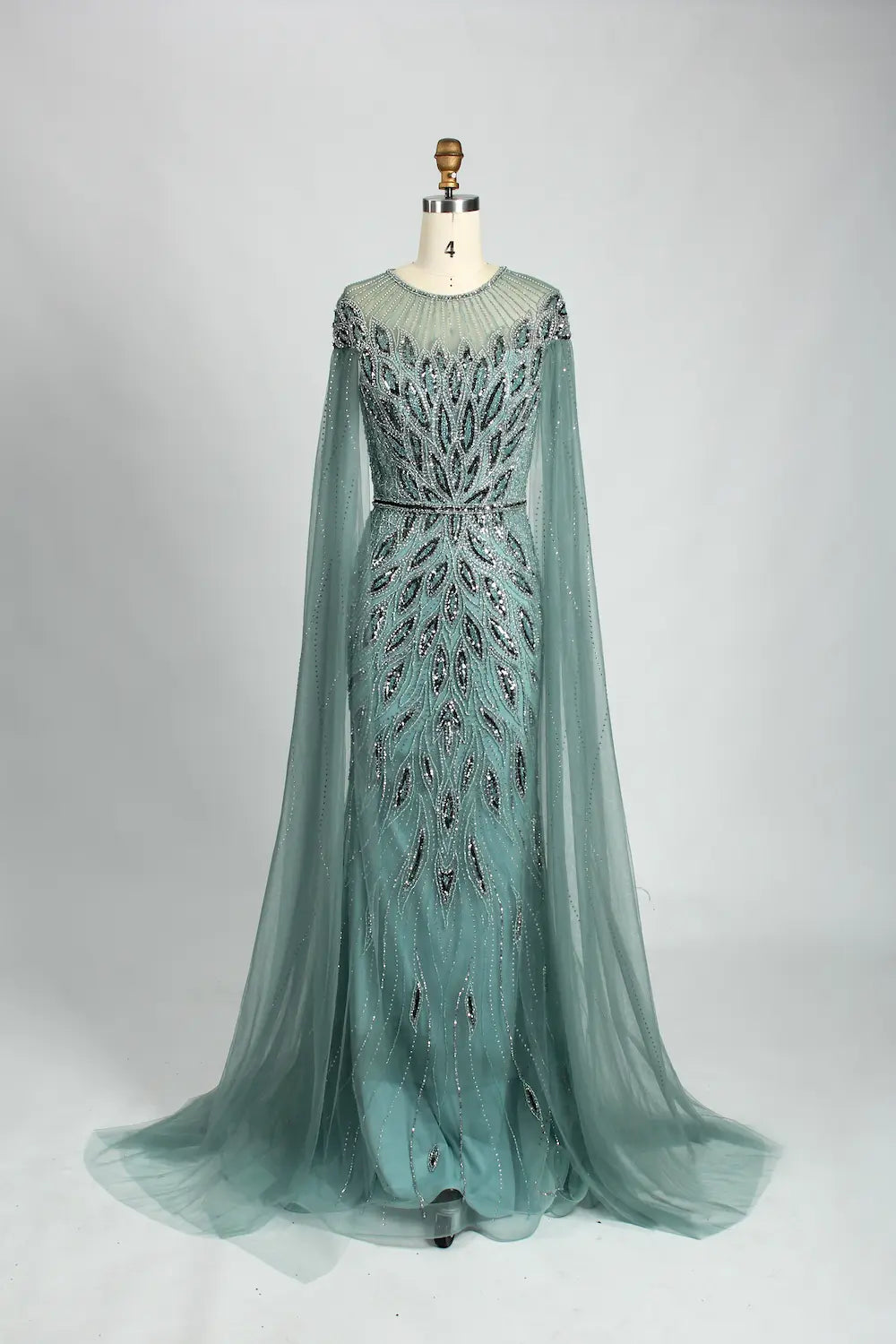 Teal beaded tulle cape mermaid evening dress with long sleeves and fitted skirt