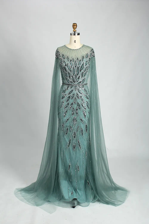 Teal beaded tulle cape mermaid evening dress with long sleeves and fitted skirt