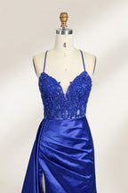 A mannequin showcases a royal - blue gown with thin straps. The bodice features intricate bead embroidery and sheer panels, while the skirt has a ruched design and a high side slit. The satin fabric and elegant details make it perfect for formal events like proms or galas, exuding sophistication.14