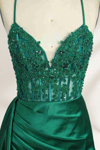 A mannequin showcases a royal - blue gown with thin straps. The bodice features intricate bead embroidery and sheer panels, while the skirt has a ruched design and a high side slit. The satin fabric and elegant details make it perfect for formal events like proms or galas, exuding sophistication.4