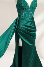 A mannequin showcases a royal - blue gown with thin straps. The bodice features intricate bead embroidery and sheer panels, while the skirt has a ruched design and a high side slit. The satin fabric and elegant details make it perfect for formal events like proms or galas, exuding sophistication.9